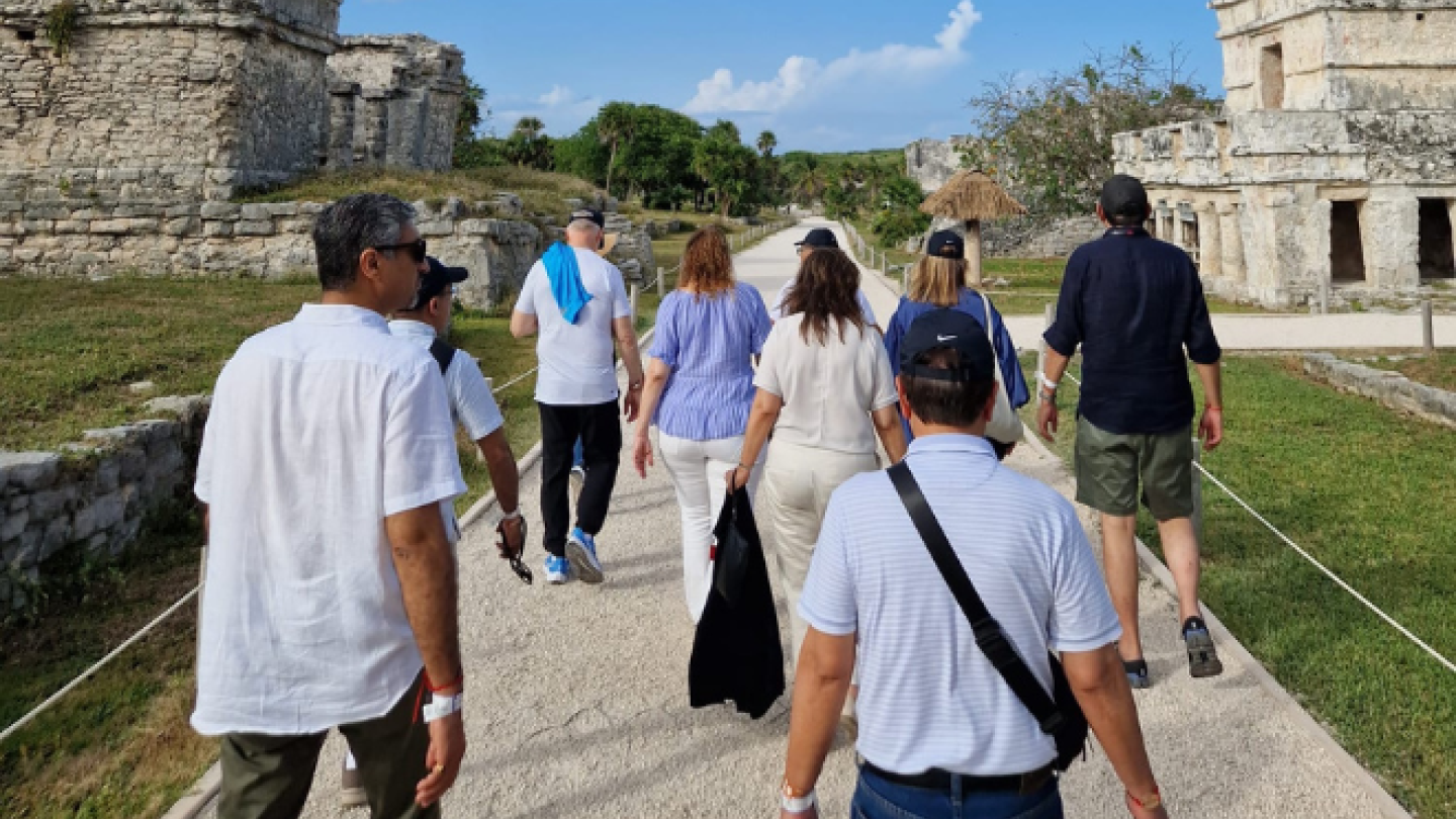 group walking to ruins